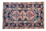 Distressed vintage Melas rug featuring blush and navy blue quatrefoil medallions, 3'11
