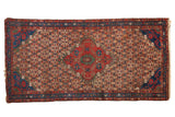 Vintage Persian Hamadan runner with red diamond medallion, sapphire blue spandrels, and floral lattice field.