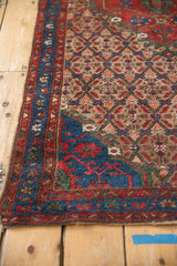 Brilliant sapphire blue corner spandrel and diamond lattice pattern of vintage Hamadan rug.