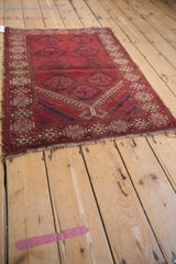 Hand-knotted vintage Beshir rug's detailed mehrab with checkered ram's horn and tattered fringe.