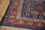 Evenly worn pile on the starburst border and navy selvage of a vintage Karaja rug.