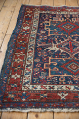 Close-up of the vintage Karaja rug's even, low pile and detailed starburst border.