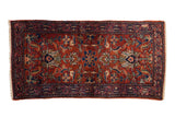 Vintage Lilihan runner, cherry red field, blue floral arabesques, fine wool sheen.