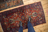 Fine wool vintage Lilihan runner: lustrous cherry red field with intricate floral arabesques.
