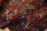 Fine wool pile on vintage Lilihan rug showing cherry red and blue floral pattern.