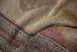 Distressed texture of the vintage Kurdish Hamadan rug, showing worn pile and geometric border.
