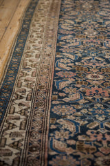 Close-up of the intricate triple borders and navy blue Herati motif on a vintage Hamadan runner.