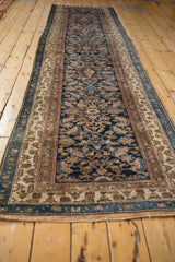 Secured side of a vintage Hamadan runner showing its complex polychrome triple borders.