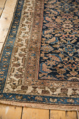 Detail of the worn knot heads and polychrome triple border on a vintage Hamadan runner.