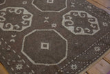 Even wear across the knot heads of the chocolate brown and ivory octagonal gul medallions.