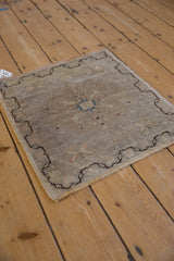 Distressed Oushak mat detail showing even wear, faint foundation, and side selvage.