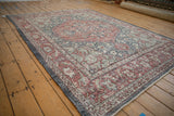 Distressed vintage Sparta carpet's intact side selvage and detailed madder red border.