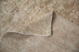 Hand-knotted vintage Oushak rug with textured pile, visible foundation, and side selvage.