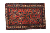 Vintage Mehreban rug with a blossom medallion and floral palmettes in dusty raspberry and sapphire blue.