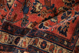 High-sheen wool pile on a vintage Mehreban rug with palmettes in raspberry and deep blue.