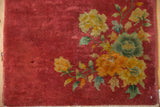 Vintage Art Deco rug, cochineal red field, jade green and saffron floral motifs, side selvage.
