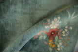 Plush sage green pile and apricot eucalyptus blossoms on a vintage Chinese Art Deco rug.