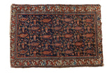 Vintage hand-knotted Mehreban rug with navy blue field, madder red paisley, and fine vinery.