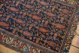 Vintage Mehreban rug detail: navy field, madder root red paisley botehs, and fine vinery.