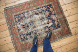Vintage Karaja rug with a floral medallion, elongated blossoms, and extensive foundation wear.