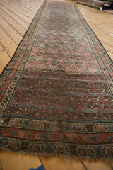 Traditional shadow boteh pattern on aubergine and blue antique Kurdish Hamadan runner showing abrashes.