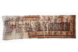 Vintage Caucasian runner, heavily distressed checkered boteh pattern in red, blue, and cream.