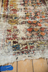 Vintage Caucasian runner featuring exposed foundation, worn madder red and blue geometric botehs.