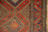 Vintage Kurdish Hamadan rug runner, geometric diamond medallions and snowflake guls in red, brown, and teal.