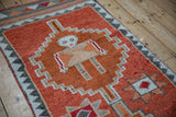 Vintage Distressed Kurd rug runner with human figure motif in rust, ivory, charcoal.