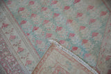 Mint green, pale red distressed Oushak pile revealing hand-knotted ivory foundation and fringe.
