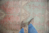 Distressed Oushak runner with distinct inverted panels of mint green and raspberry red.