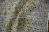 Distressed vintage Oushak rug detail: softened pile, abrashes, muted green, dusty blush colors.