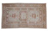Distressed Oushak carpet, triple gul medallions in coffee, blush, and ivory tones, 5'3
