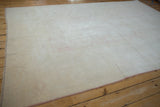 Distressed hand-knotted Dosemealti carpet texture, faint patterns, and visible weaver delimiters.