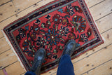 A small hand-knotted Persian Lilihan rug mat shown for scale underfoot.