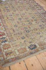 Detail of antique Caucasian rug, featuring unique floral-geometric field design and visible wear.