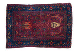 Fine hand-knotted vintage Farahan Sarouk rug, deep burgundy field, sapphire blue botanical border.