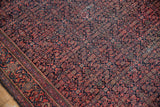 Vintage Farahan Sarouk rug's intricate small scale Herati pattern in navy, terra cotta, sapphire.