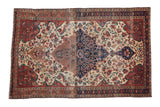 Antique Persian Farahan Sarouk rug with dramatic medallion, floral design, abrash. 4'2