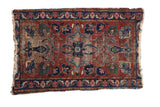 Lilihan rug, cherry red field, central shadow medallion, palmettes, and serrated border with wear.