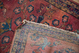 Folded corner of Vintage Lilihan rug, showing pile and intricate hand-knotted border on reverse.