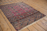 Intricate geometric borders and deep blue selvedge on the antique Turkmen rug.