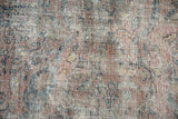 Distressed Vintage Mahal carpet detail, revealing foundation, faded pink, teal, and gold motifs.