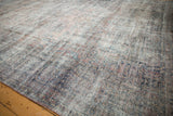 Distressed Mahal carpet detail showing worn pile, visible foundation, and muted floral patterns.