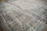 Distressed Mahal carpet pile showing foundation with muted pink, teal, and gold colors.