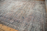 Distressed vintage Mahal rug corner, worn pile, revealing foundation and original selvage.