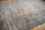 Worn texture of distressed vintage Mahal carpet, with foundation showing through.
