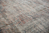 Distressed vintage Mahal rug texture, showing areas of visible foundation and faded florals.