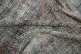 Heavily textured distressed vintage Mahal carpet, foundation visible with faded pink, teal, gold.