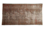 Distressed vintage Persian Hamadan carpet, faded herati design in dusty blush, navy, and foundation tones.